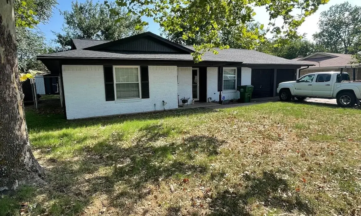 Professional roofing crew working on a residential roof in Pebble Creek